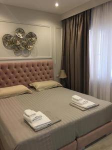 Postel nebo postele na pokoji v ubytování Onira luxury rooms