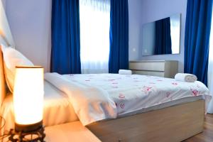 Кровать или кровати в номере ---Allegria House---
