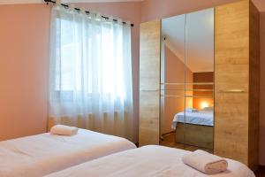 Кровать или кровати в номере ---Allegria House---