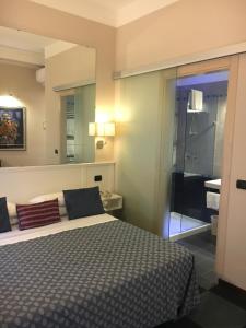 Ένα ή περισσότερα κρεβάτια σε δωμάτιο στο Boutique Hotel Scalzi - Adults Only