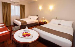 Postel nebo postele na pokoji v ubytování DM Hoteles Nasca
