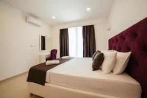 Ένα ή περισσότερα κρεβάτια σε δωμάτιο στο Hotel Ambiente Ulcinj