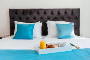 Ένα ή περισσότερα κρεβάτια σε δωμάτιο στο Hotel Ambiente Ulcinj