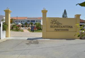 a sign for a kontikiimmune apartment building at Konstantina Apartments in Kavos