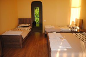 Letto o letti in una camera di David Guest House