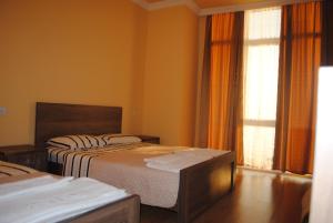 Letto o letti in una camera di David Guest House