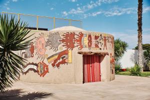 a building with graffiti on the side of it at DM Hoteles Nasca in Nazca