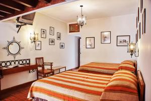 Postel nebo postele na pokoji v ubytování DM Hoteles Nasca