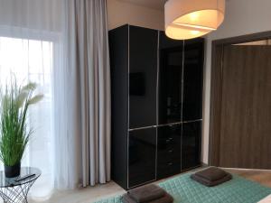 Posteľ alebo postele v izbe v ubytovaní Apartament LUX Green basen SPA Pięć Mórz Sianożęty