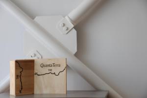 a cardboard box sitting on a table in a attic at Capim Dourado Apartments Cedofeita in Porto