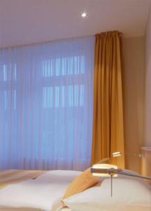 Llit o llits en una habitació de Gästehaus Rohleder