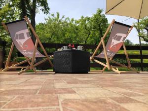 two folding chairs with a speaker sitting in them at Kod Basaričeka in Donja Stubica