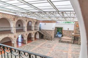 a view of therium of a building with a balcony at Hotel El Cristo in Cholula +41 photos