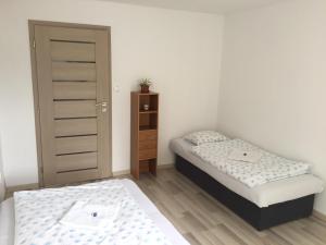 Кровать или кровати в номере City Centre Apartment Liptovsky Mikulas