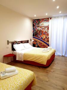 Letto o letti in una camera di B&B Gisira