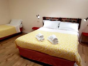 Letto o letti in una camera di B&B Gisira