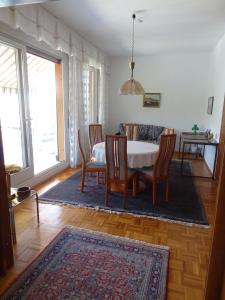 a dining room with a table and chairs at Casa Abel in Campione dʼItalia