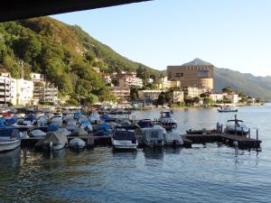 a bunch of boats are docked in the water at Casa Abel in Campione dʼItalia