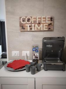 a counter with a coffee maker and a toaster at BGY Central Apartments in Bergamo