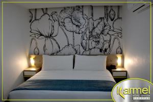 Letto o letti in una camera di Hotel Karmel
