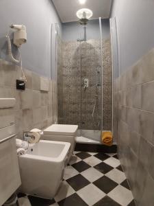a bathroom with a shower and a toilet and a sink at Jeans Luxury House in Genova +21 photos