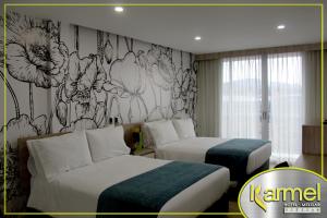 Letto o letti in una camera di Hotel Karmel