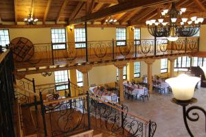 an overhead view of a building with tables and chairs at Hotel JYE by Serranillo, Mineral del Monte Hgo in Mineral del Monte