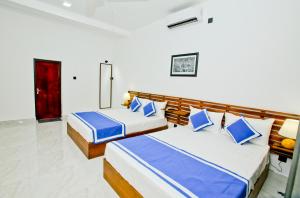 Giường trong phòng chung tại Sapumal Lodge