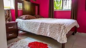 Postel nebo postele na pokoji v ubytování Villa Strelitzia Cabarete