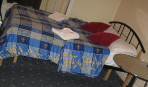Postel nebo postele na pokoji v ubytování Hotel Sophia