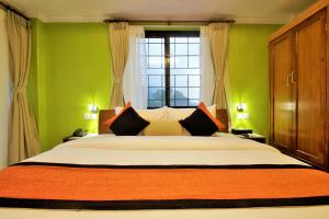 Letto o letti in una camera di Hotel Raniban Arcade