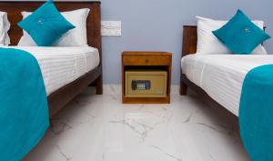 A bed or beds in a room at MRD Beach Hotel