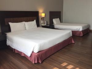 Postel nebo postele na pokoji v ubytování Grand Kampar Hotel