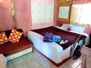 Postel nebo postele na pokoji v ubytování Tiddin Resort