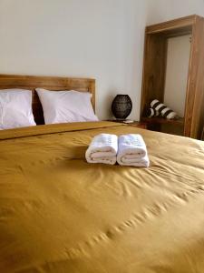 En eller flere senge i et værelse på Kak Poleng Guesthouse