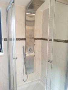 a shower with a glass door in a bathroom at Ferienwohnung Sandra in Heilbad Heiligenstadt