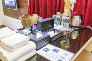 TV a/nebo společenská místnost v ubytování Newrise Hotel