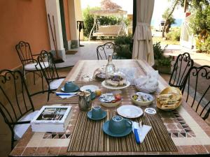 a table with plates of food on top of it at Il Sestante B&B in Condofuri