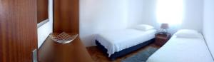 a small bedroom with a bed and a small table at Augustinovi Dvori in Škrip +14 photos