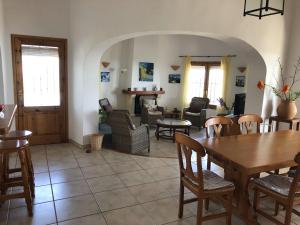 a living room with a table and chairs at Villa Luz del Monte in Denia +33 photos