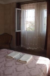 A bed or beds in a room at Emre's Stone House