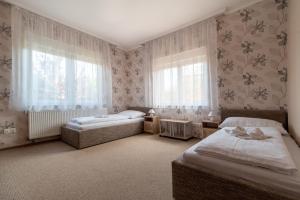 Posteľ alebo postele v izbe v ubytovaní Villa Topáz