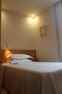 Posteľ alebo postele v izbe v ubytovaní Hotel Zarampallo