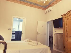Postel nebo postele na pokoji v ubytování Il Sogno Torino Guesthouse