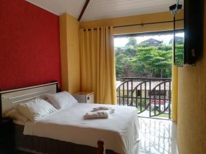 Postel nebo postele na pokoji v ubytování Paratibela Pousada