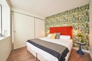 a bedroom with a large bed and a large window at Lisbon Best Choice Prime Apartments Alfama in Lisbon