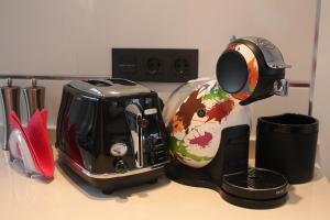 a kitchen counter with a coffee maker and a toaster at PENTHOUSE OASIS BEACH in Playas de Orihuela