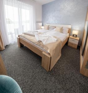 Posteľ alebo postele v izbe v ubytovaní Hotel Prístav