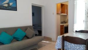 a living room with a couch and a table at Milu in Pirovac +24 photos