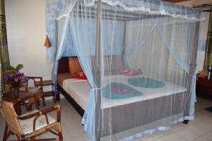 Ein Bett oder Betten in einem Zimmer der Unterkunft Whitepearl Beach